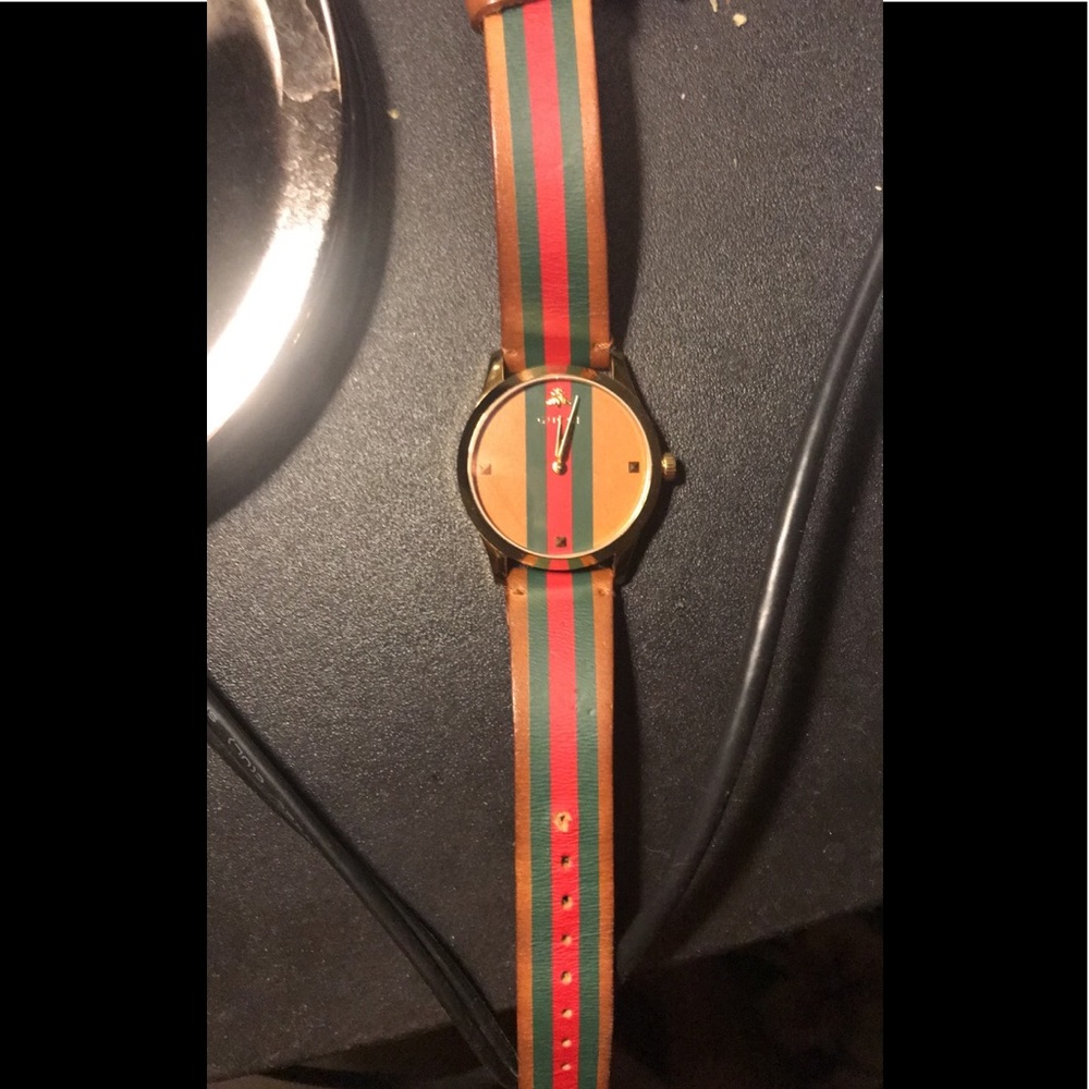 A leather Gucci watch